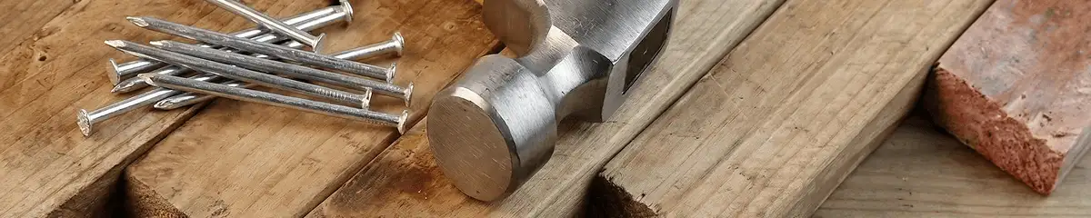 Hammer and nails on hardwood flooring boards in Duluth, MN